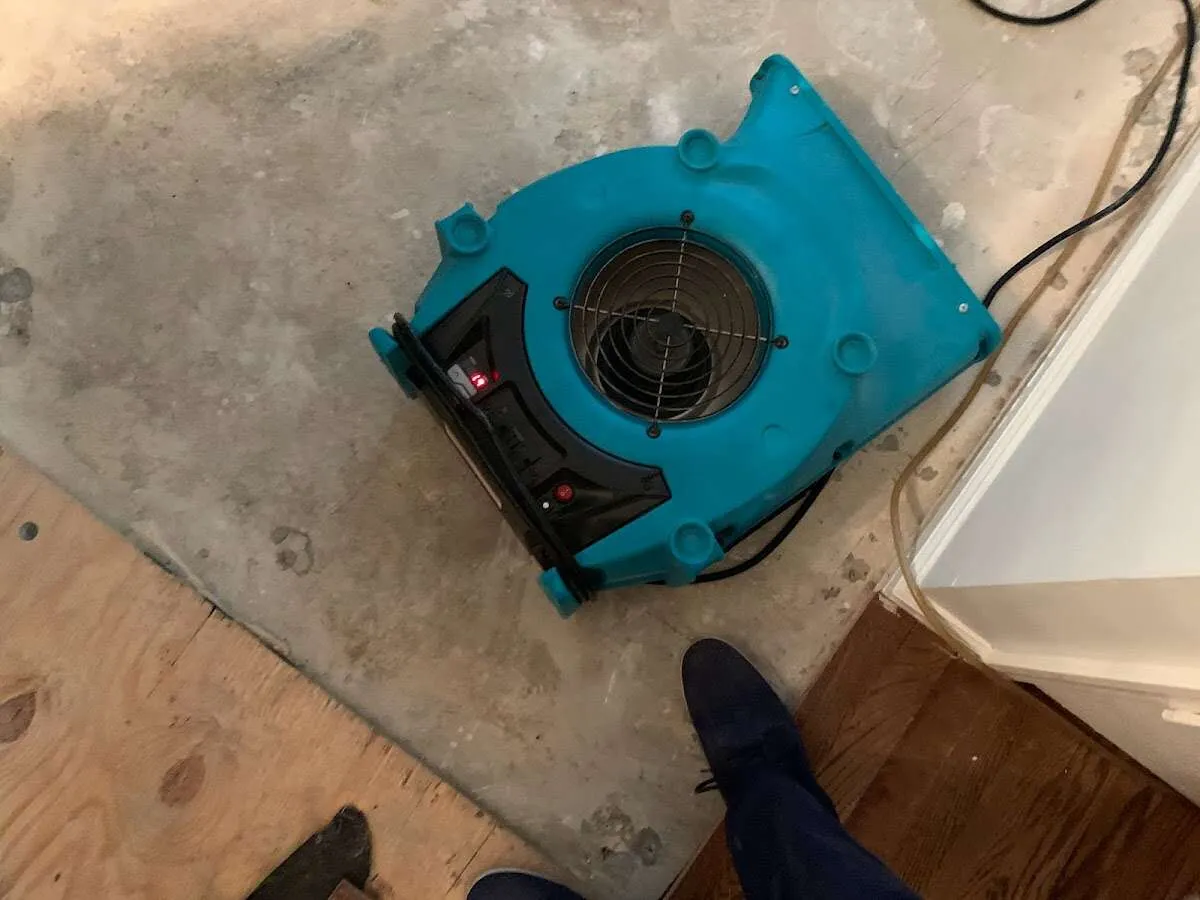 Air mover drying subfloor during Leak Detection & Repair in North Salt Lake